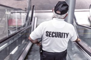 A security officer on the escalator